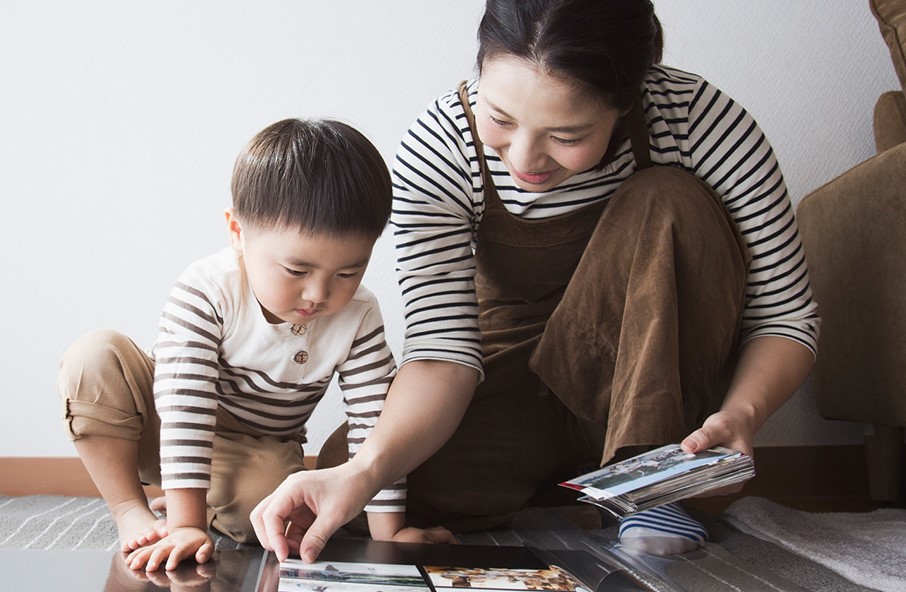 mother playing and teaching her child a mother's role in early childhood development