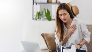 person taking medication for heart disease